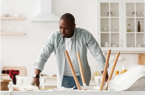 a young man standing in his workshop