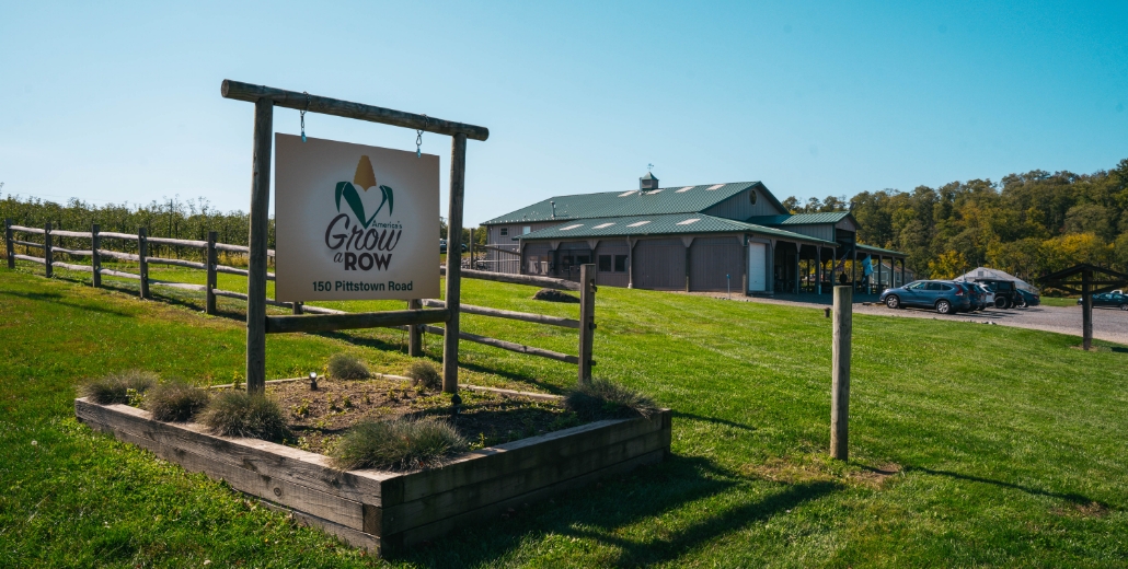 street sign for grow a row farm