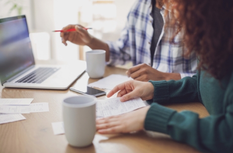 A couple reviewing their financial status at a desk