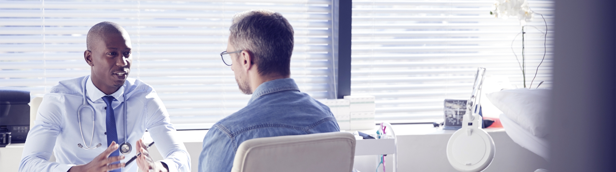 Doctor meeting with patient in office