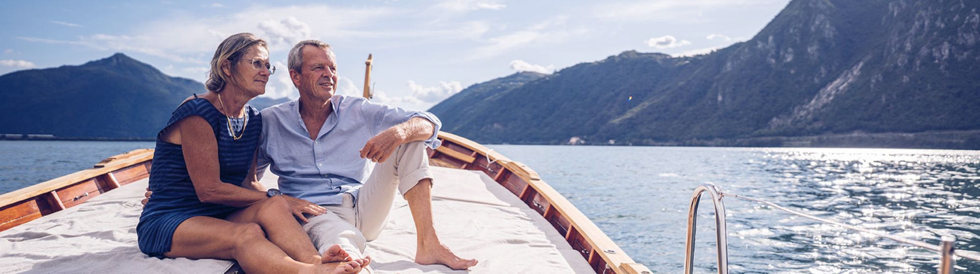 Older couple enjoying a sunset on a boat