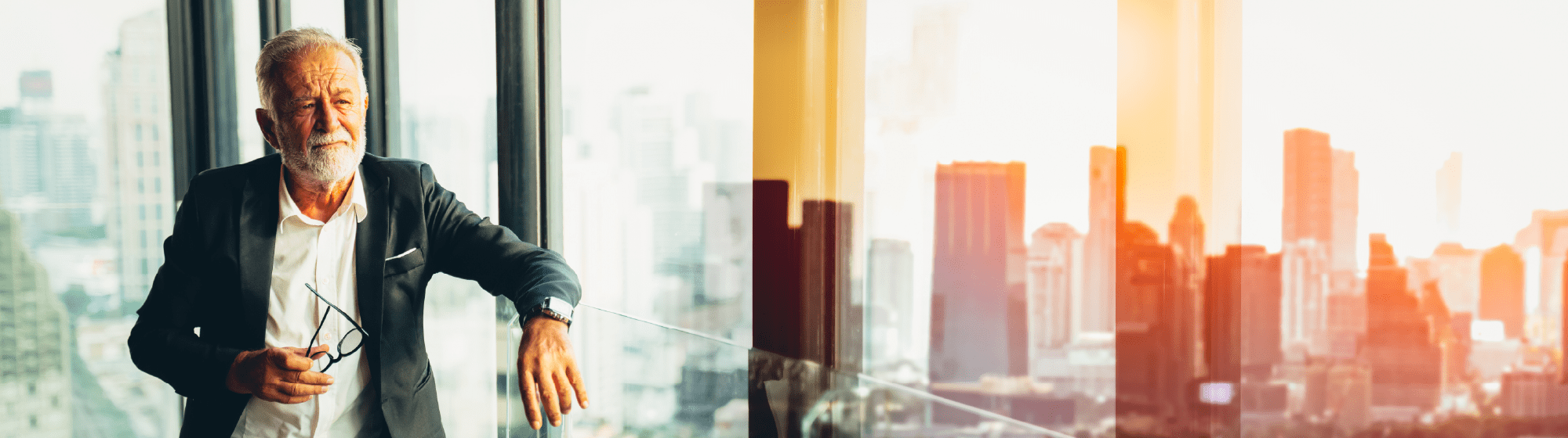 Consultant looking out a window in his office