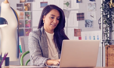 young woman entrepreneur working at her desk