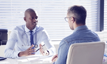 Doctor meeting with patient in office