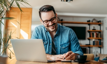 middle aged man applying for a home equity on computer