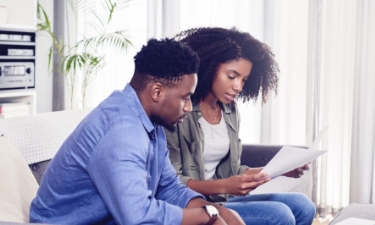 a couple scheduling an appointment with AFCU