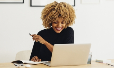 woman in her home reading a wellbeing article