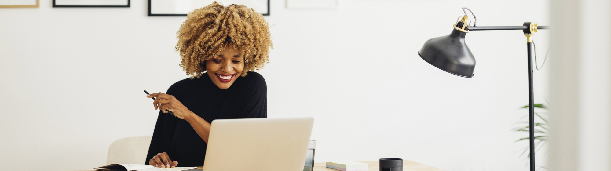 woman in her home reading a wellbeing article