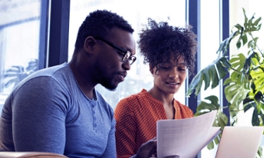 couple discussing taking out a personal loan at home