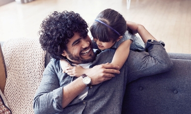 father and daughter hugging 